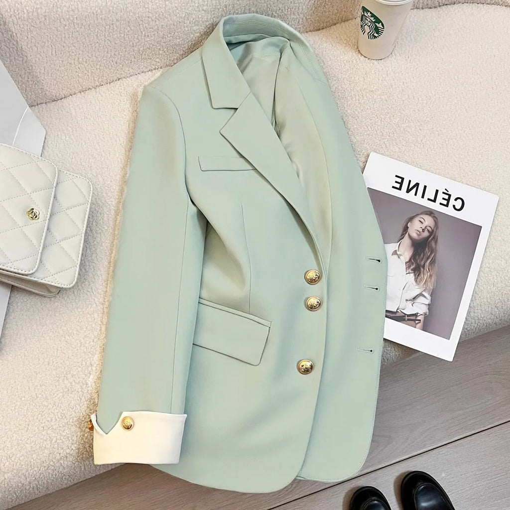 Women's Korean-style coat in solid colour with loose fit, 65cm length, and pockets for commuting wear.