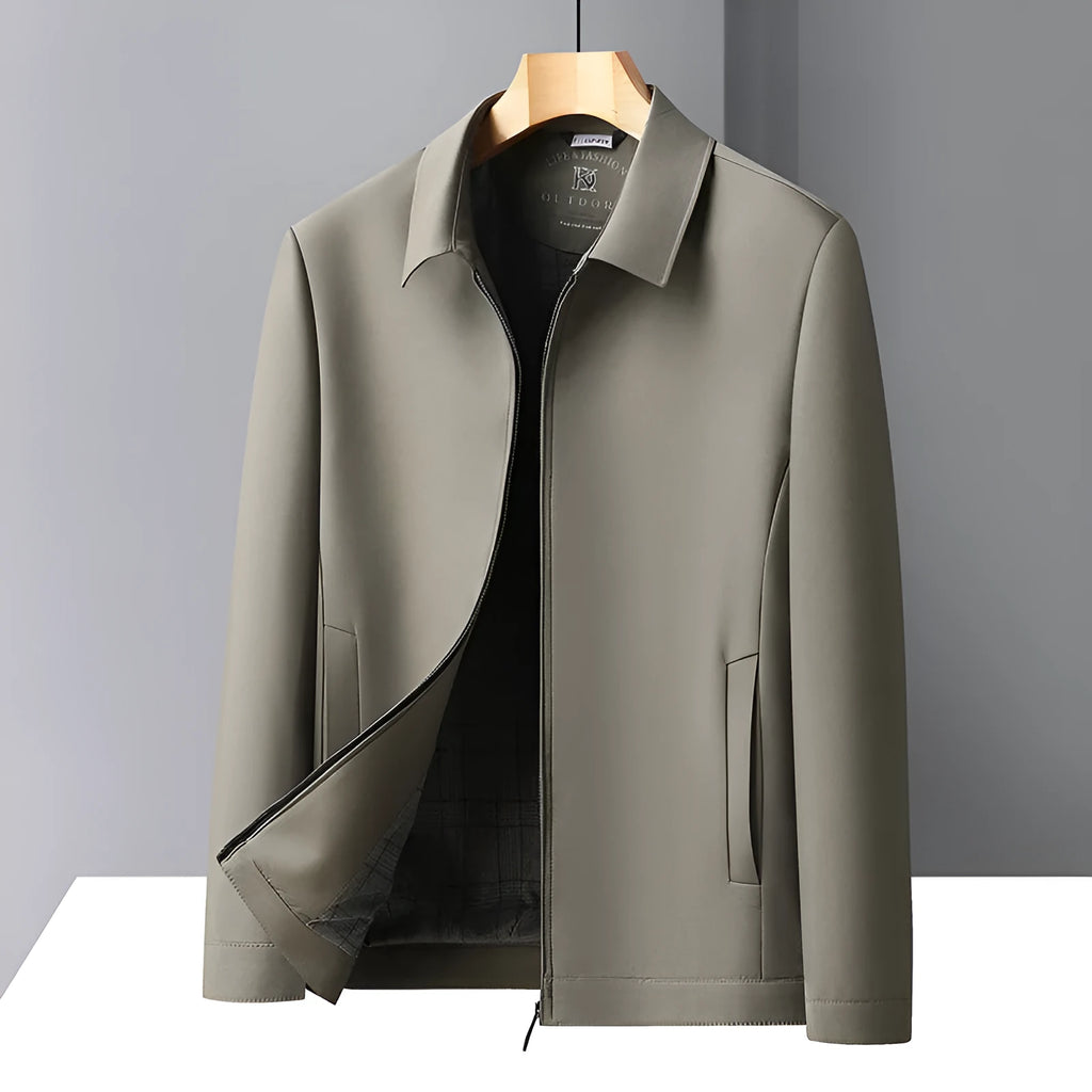 Man wearing a khaki polo collar loose-fit casual jacket with side seam pockets.
