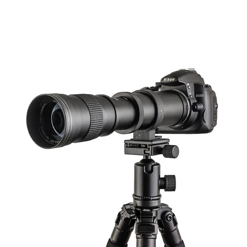Black manual telephoto zoom camera lens with 420-800mm focal length shown next to its T-mount adapter ring.
