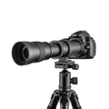 Black manual telephoto zoom camera lens with 420-800mm focal length shown next to its T-mount adapter ring.