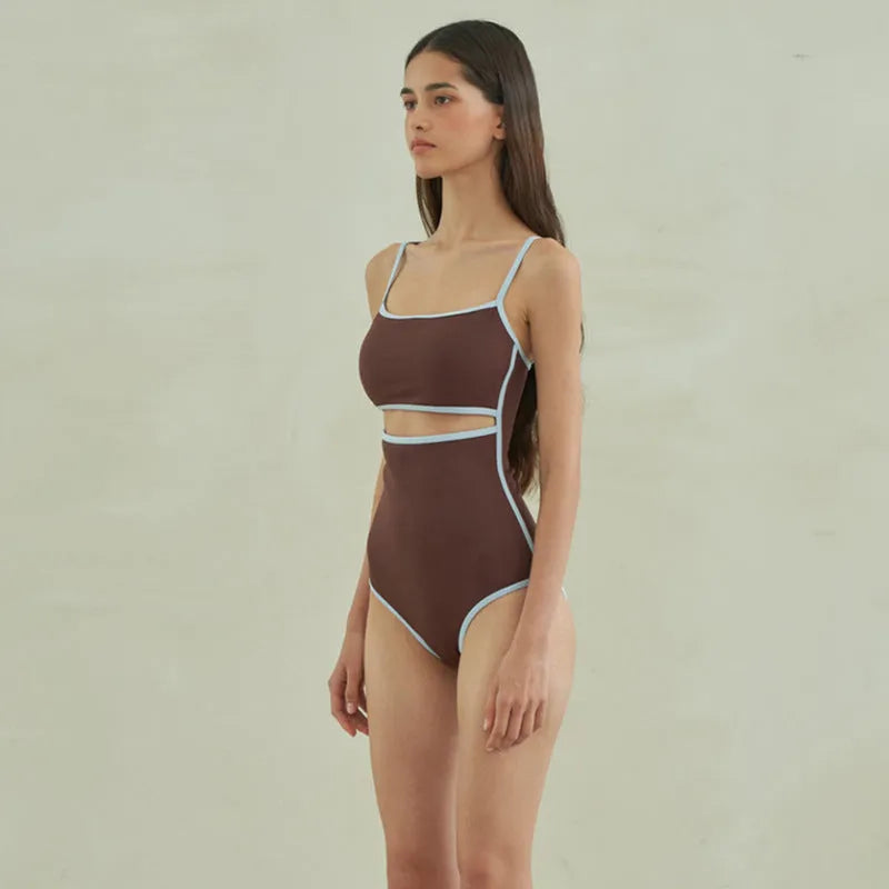 Brown triangle one-piece swimsuit for women with nylon fabric and sizes M, L, XL.