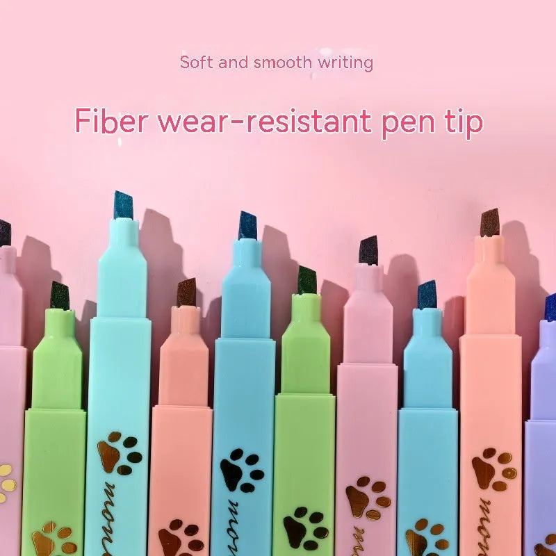 Box of six cat's paw fluorescent marking pens with oblique nib tips in assorted colours.