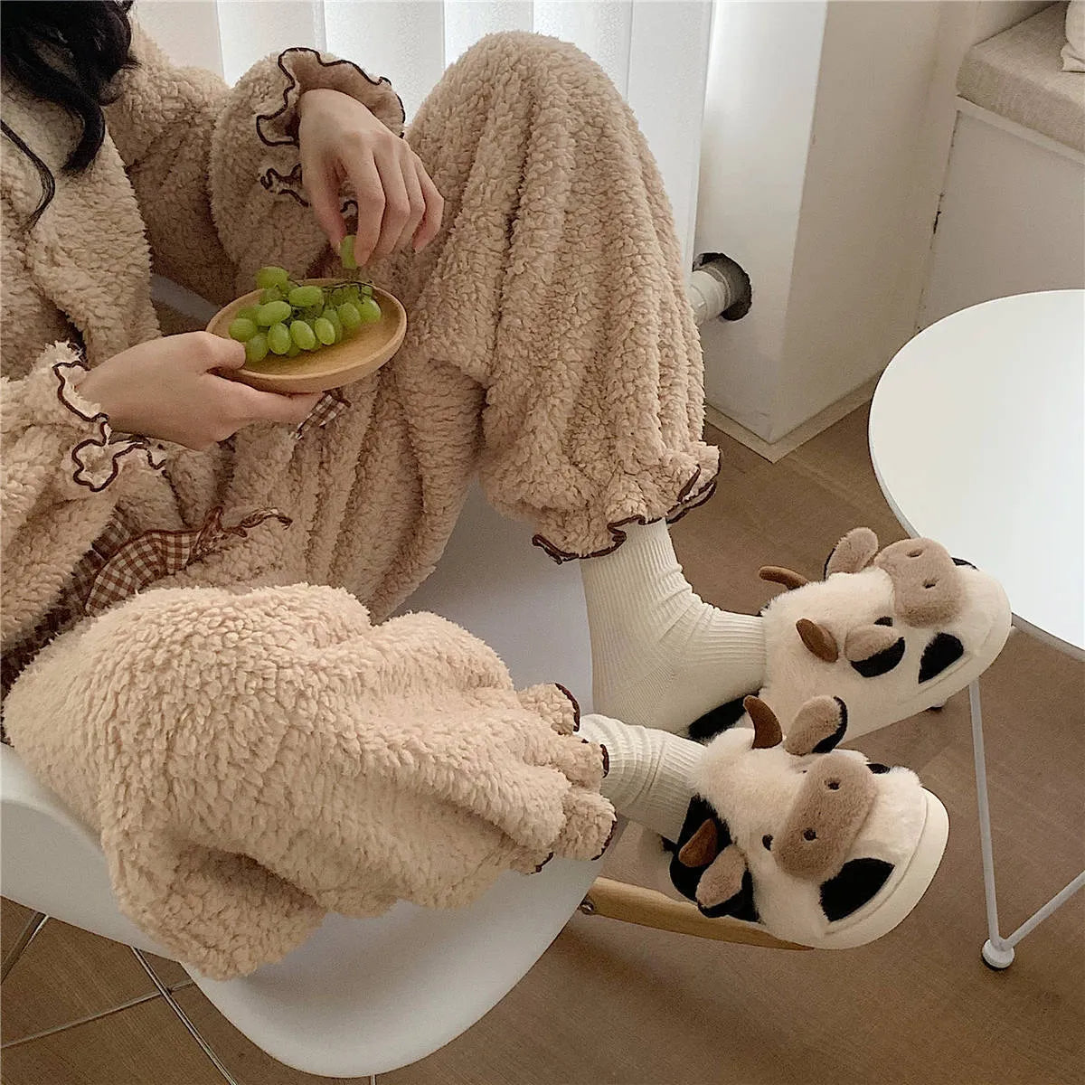 Women's cow slippers with faux fur upper, non-slip PVC sole, and plush lining in white colour