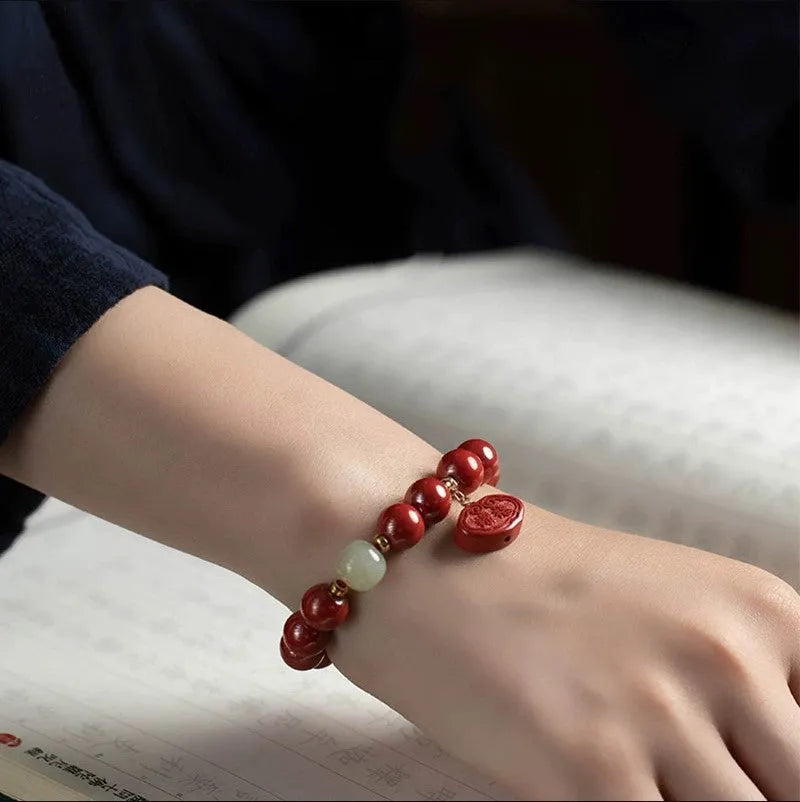 Cinnabar bracelet with Emperor Sandstone style and Ping An Fu Lu design in 8mm or 10mm bead size