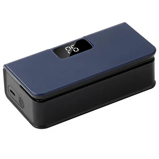 Small white portable heat sealing machine for plastic food bags on a kitchen counter.