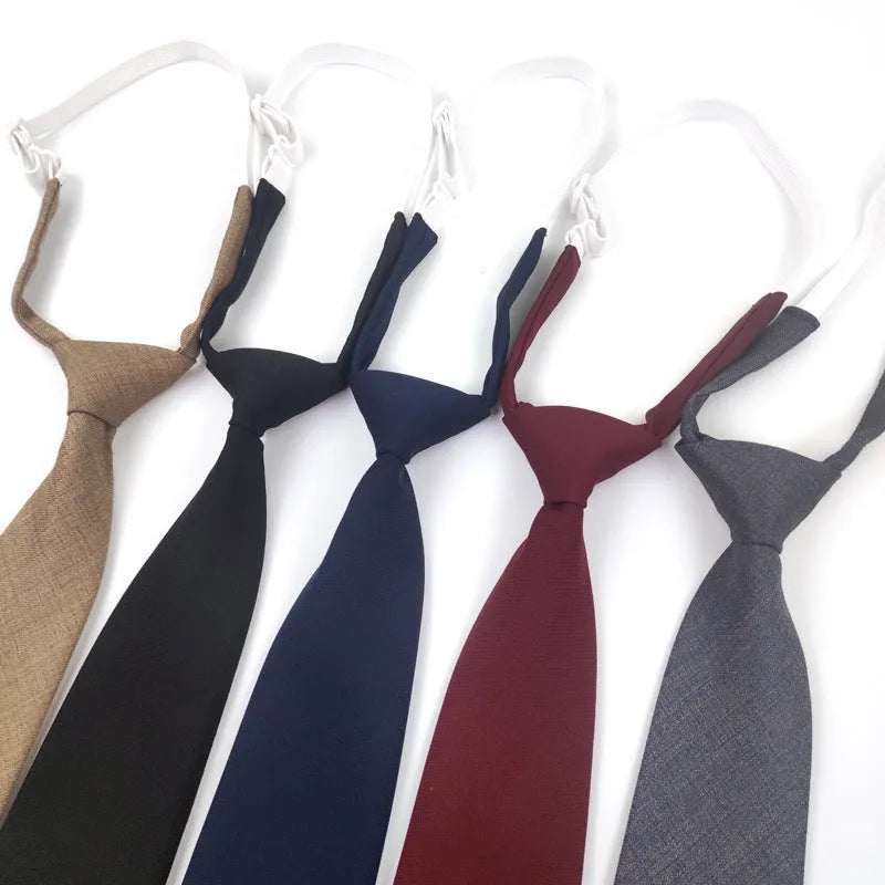 Navy blue solid colour cotton men's tie with arrow style design on a white background.