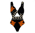 Women's black one-piece swimsuit made from polyester with a lining, shown on a model.