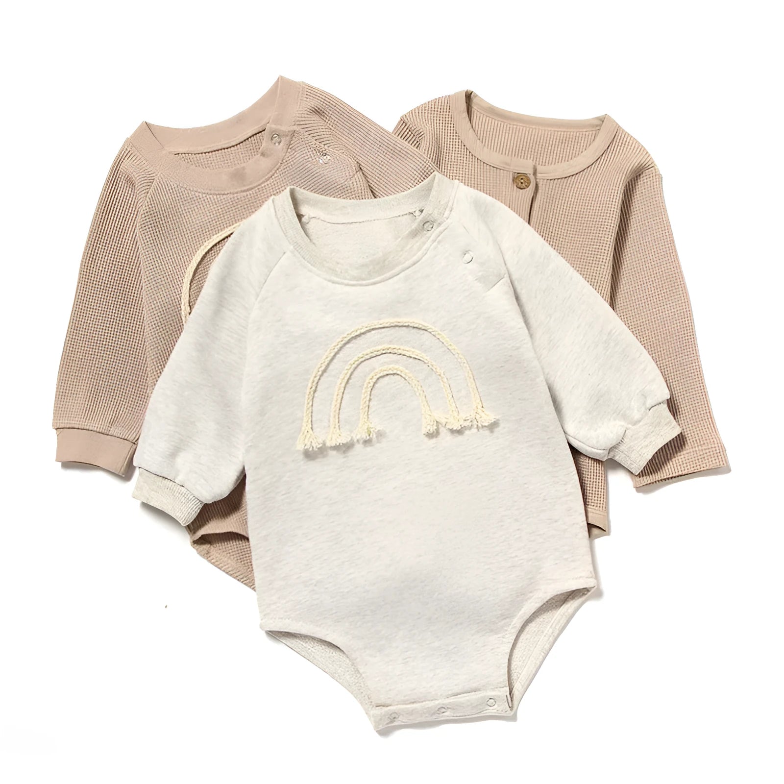 Long sleeve baby romper in waffle cotton fabric, shown in beige with cotton rope tie closure.