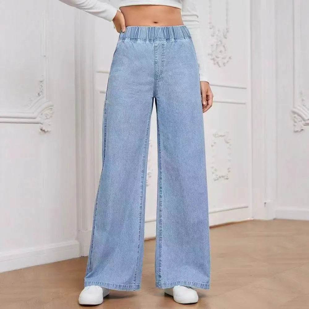 Light blue washed wide-leg straight jeans with mid-waist design and zip placket closure on hanger