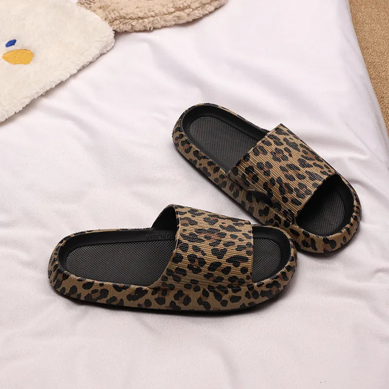 Leopard print slippers with thick EVA sole showing slip-on design and animal pattern details