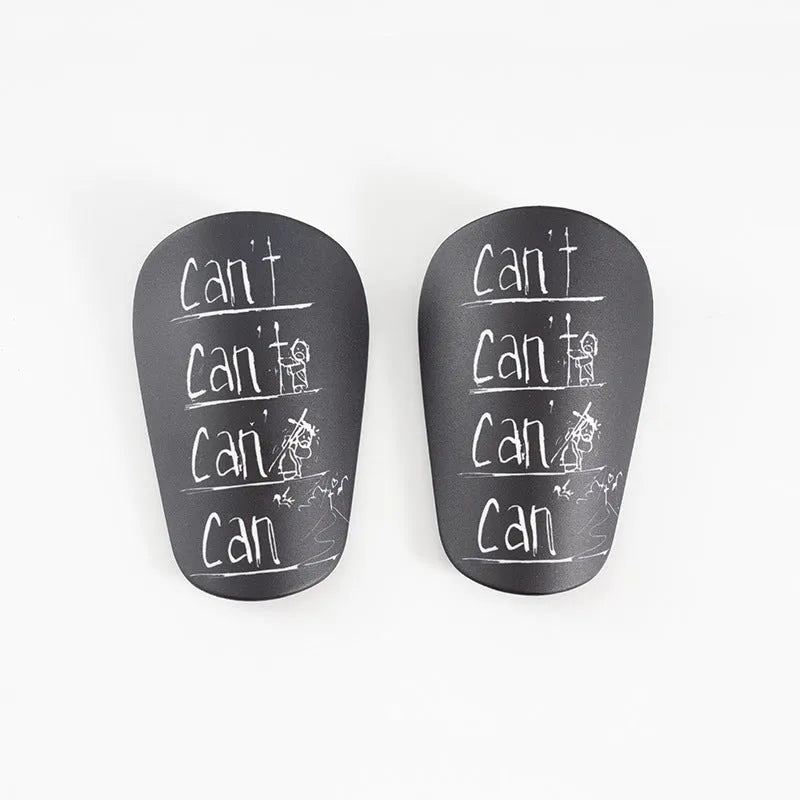 Pair of football shin guards in black colour showing front protective design
