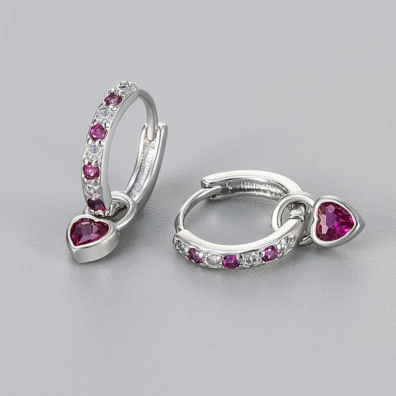 Fashion zircon earrings with heart-shaped eardrops in gold or white gold colour settings with diamond-treated gemstones