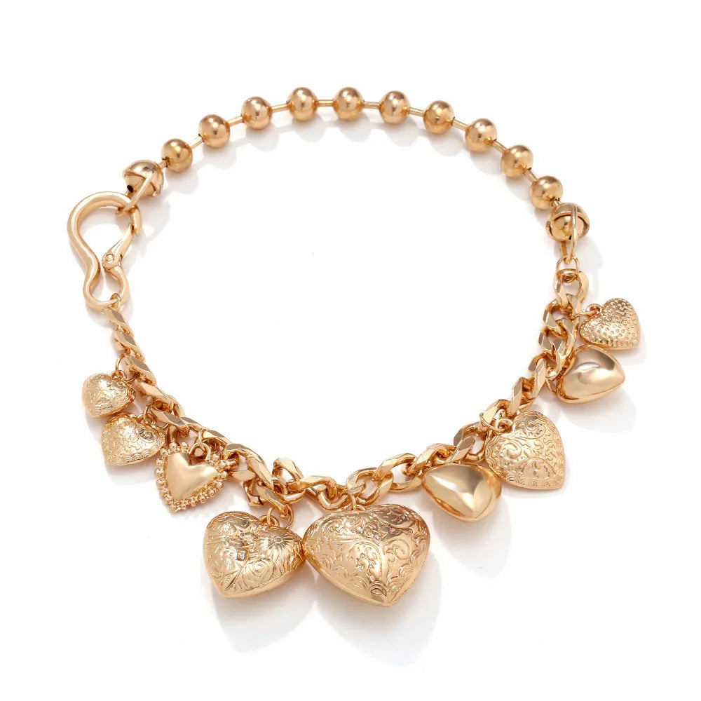Gold heart pendant necklace with textured dripping oil finish on adjustable chain