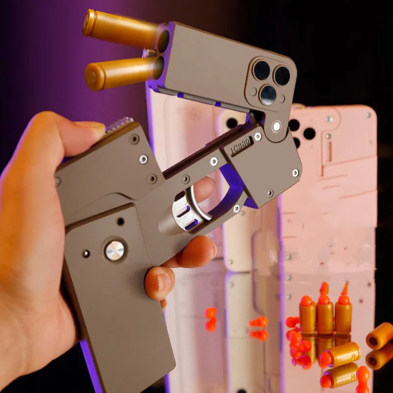 Folding mobile phone toy dart blaster in pink showing double barrels and safe EVA foam bullets