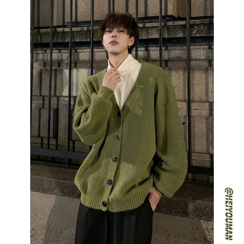 Men's loose-fit retro V-neck cardigan sweater in army green, shown on a hanger.