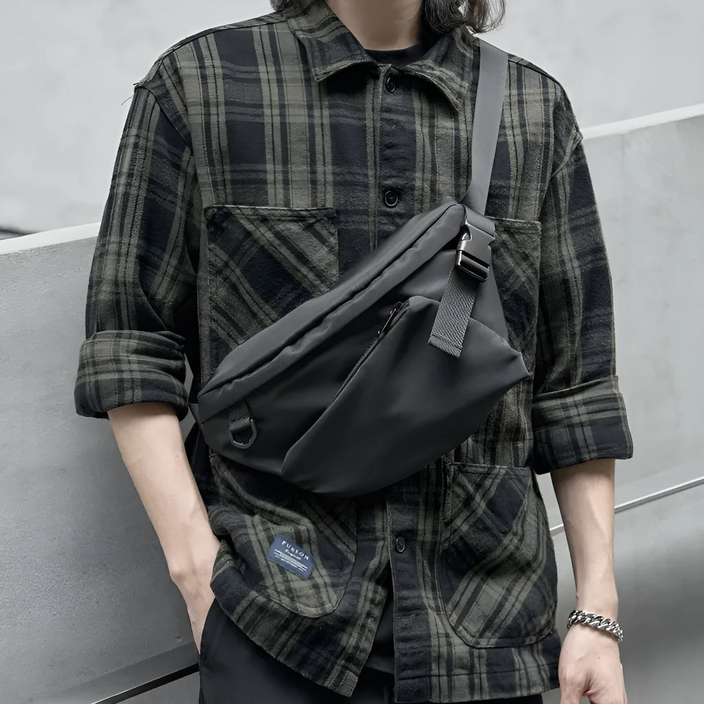 Black men's slanted chest bag with sewing line detail, made from Oxford fabric.