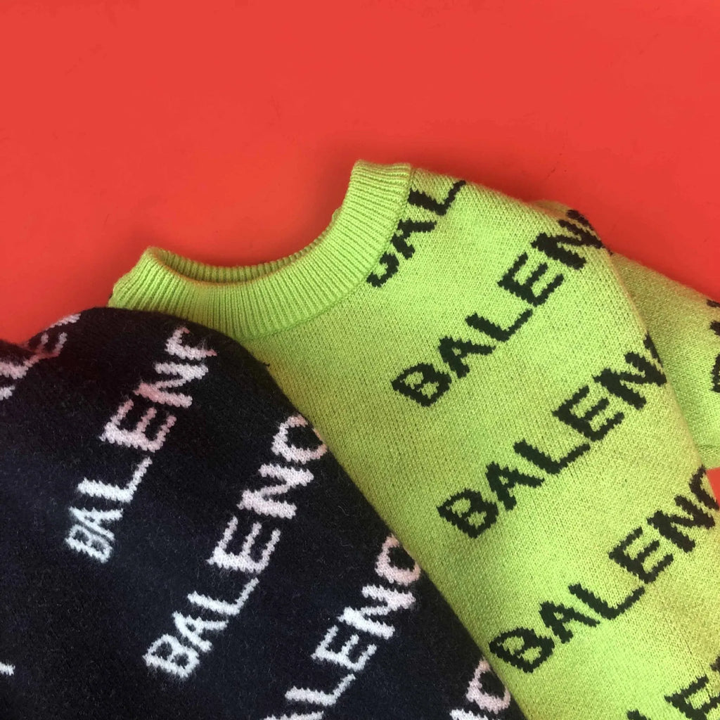 Acrylic pullover dog sweater in black or green, sizes S to 2XL, shown for schnauzer and small dog use.