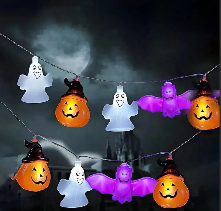 Halloween LED string lights with pumpkin, ghost and bat shaped covers, battery operated, PVC shell, warm white.