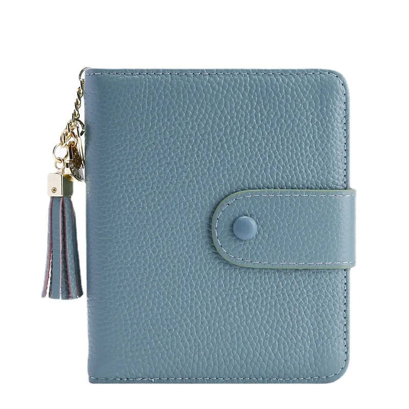 Large capacity genuine cowhide leather card holder wallet with tassel, snap closure, 40 card slots, and ID holder