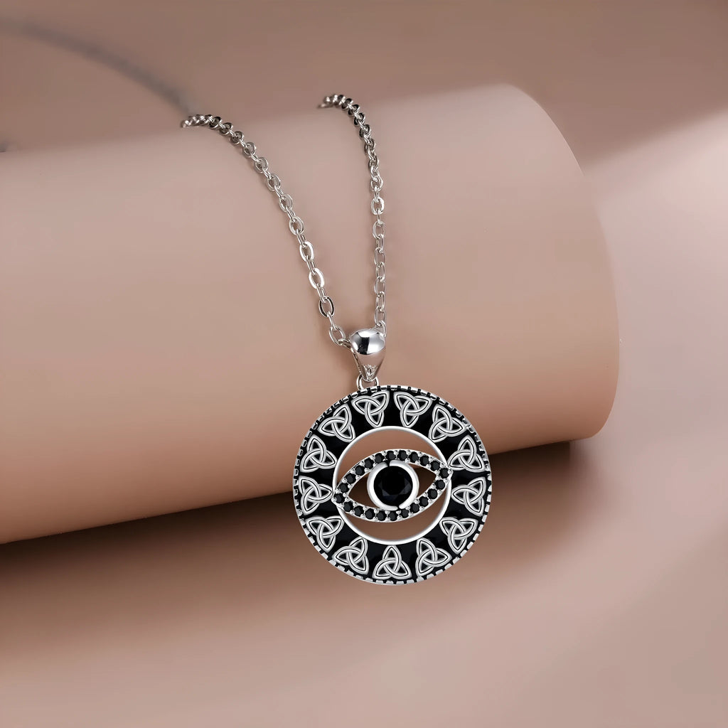 Copper devil's eye pendant necklace on a cross chain for women.
