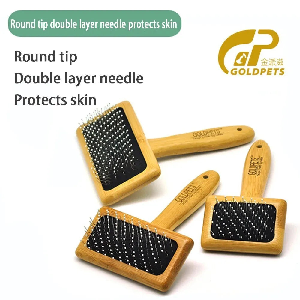 Goldpets bamboo wood pet slicker brush with stainless steel pins on a wooden table