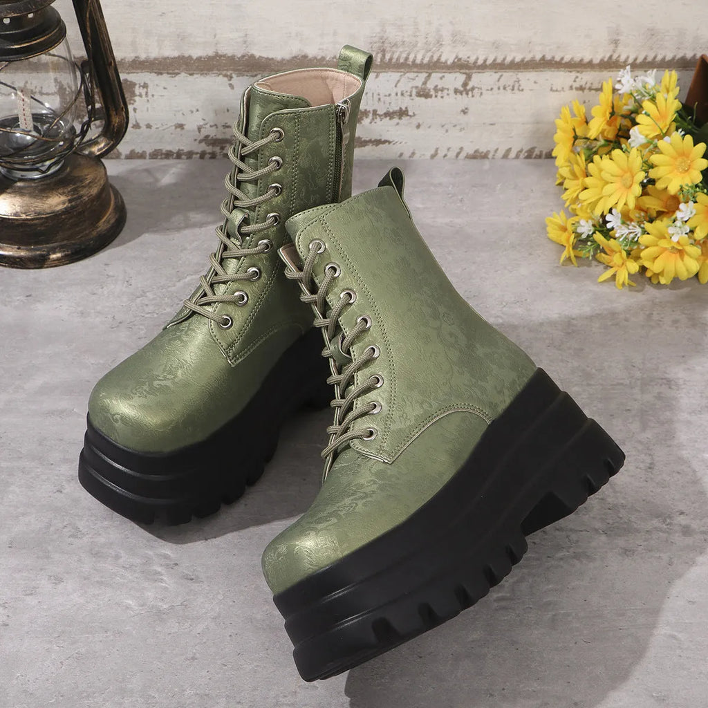 Women's black platform Martin boots with chunky heel and side zipper on a wooden floor
