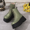 Women's black platform Martin boots with chunky heel and side zipper on a wooden floor