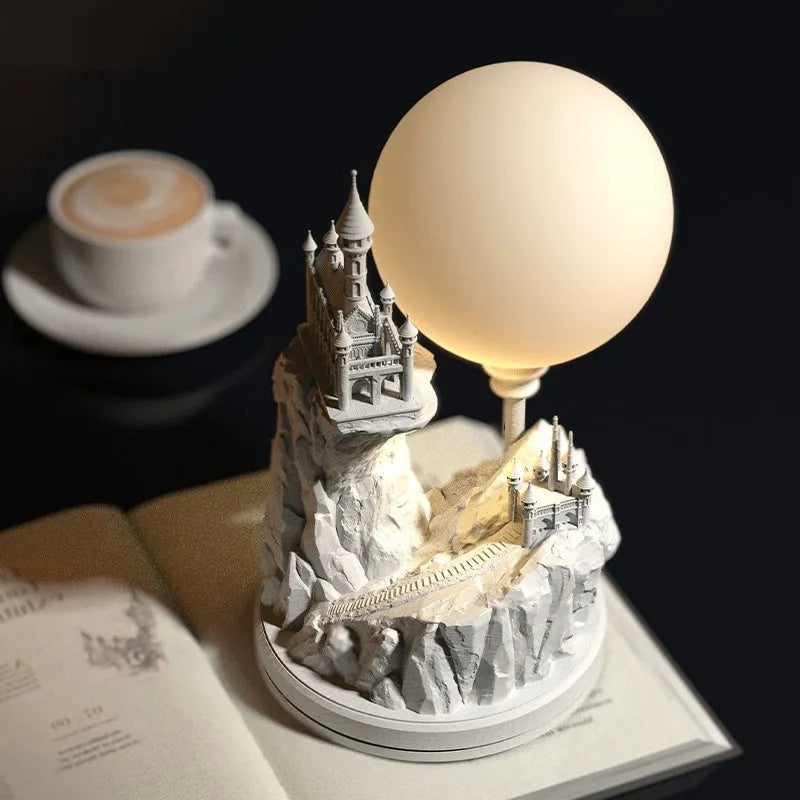 White composite gypsum table lamp with a plug-in cord and wire switch, shown on a bedside table.