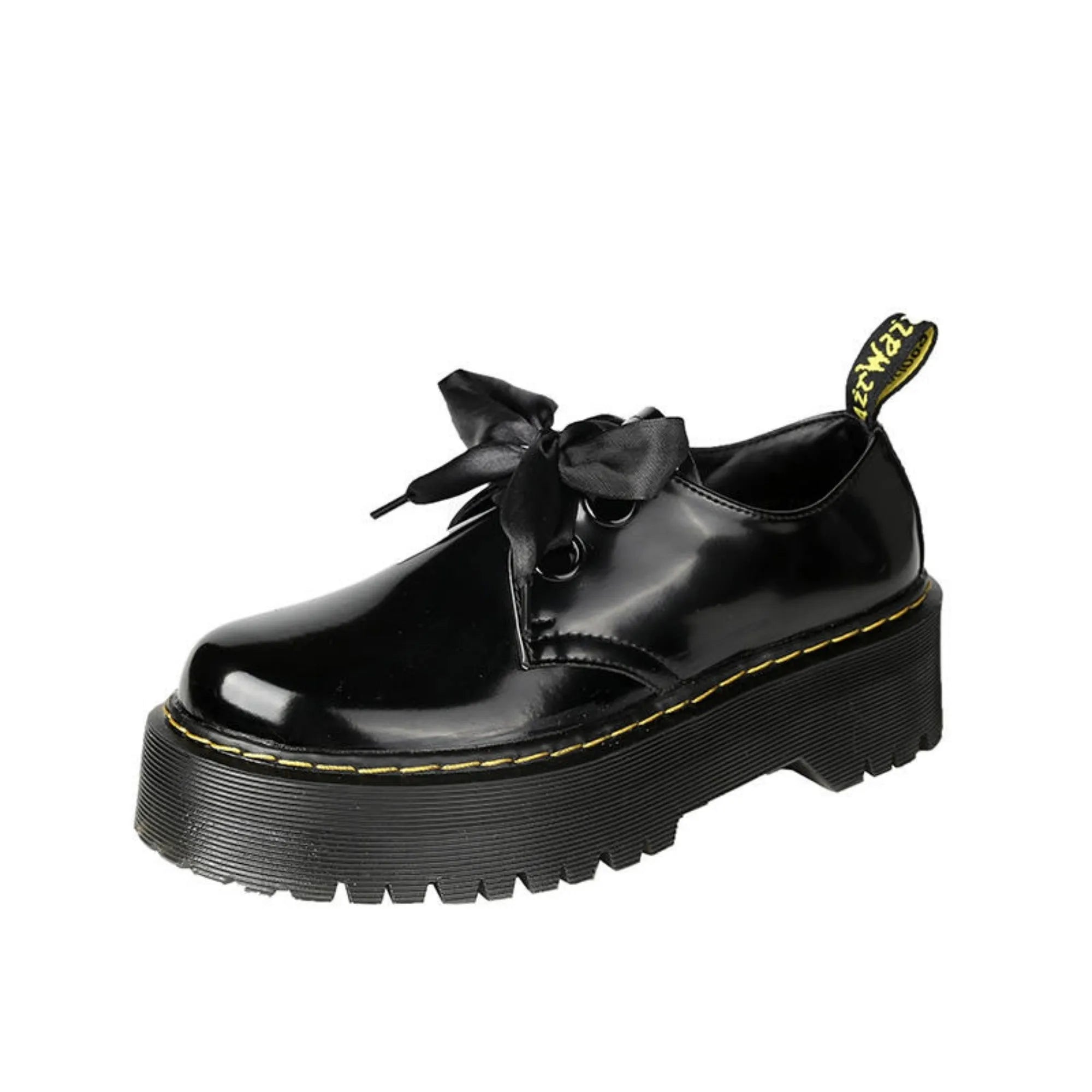 Women's black leather shoes with cross-strap design and thick TPR soles, showing ribbon detailing and lacing closure