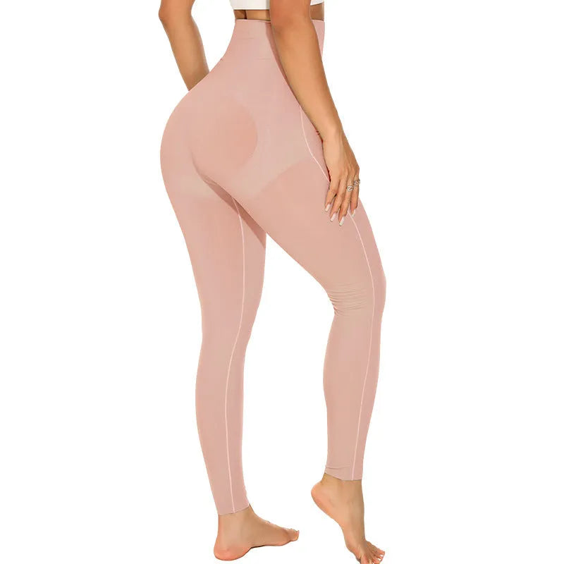 Women's black belly contracting yoga trousers with seamless design on a mannequin