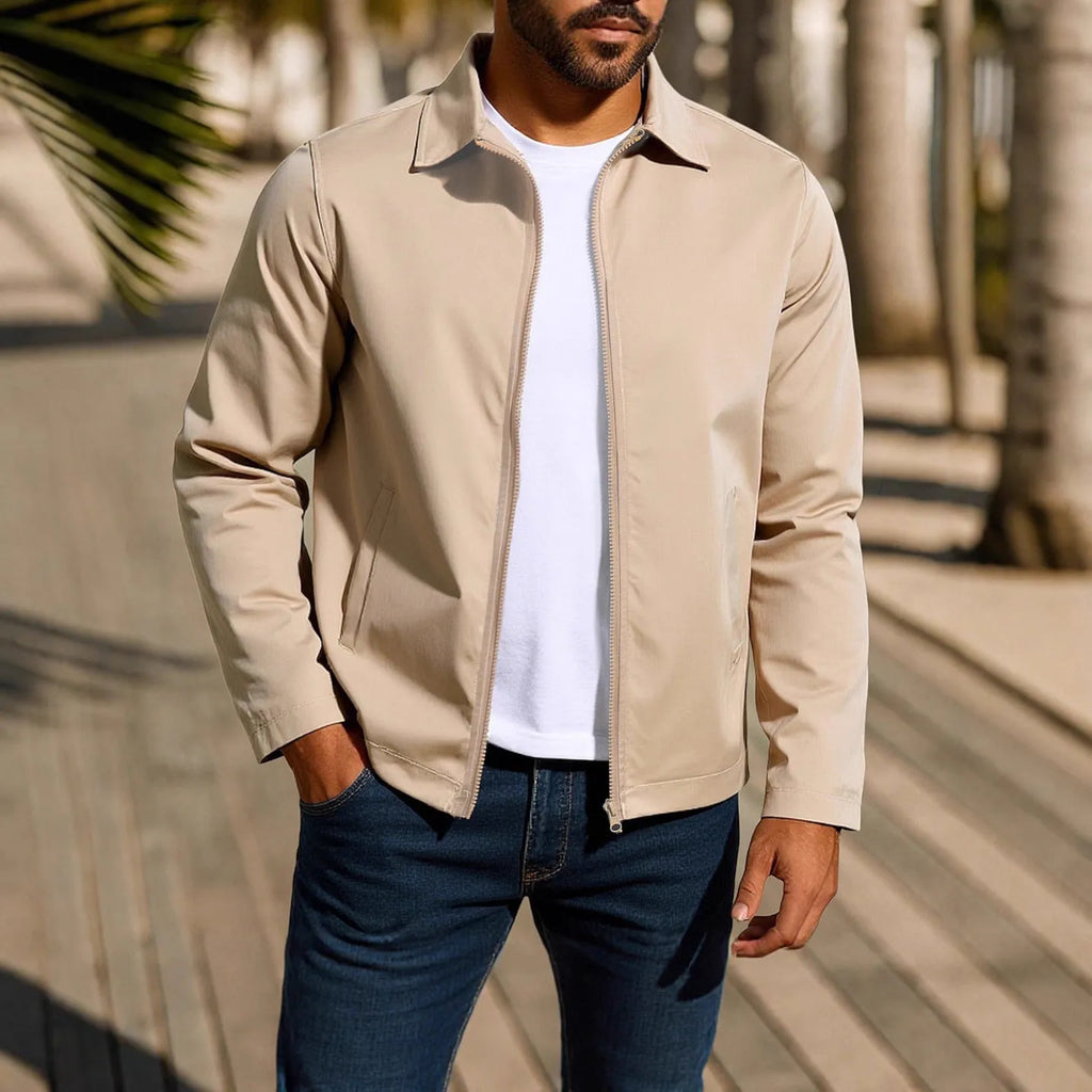 Man wearing an emerald green zippered cardigan jacket with raglan sleeves.