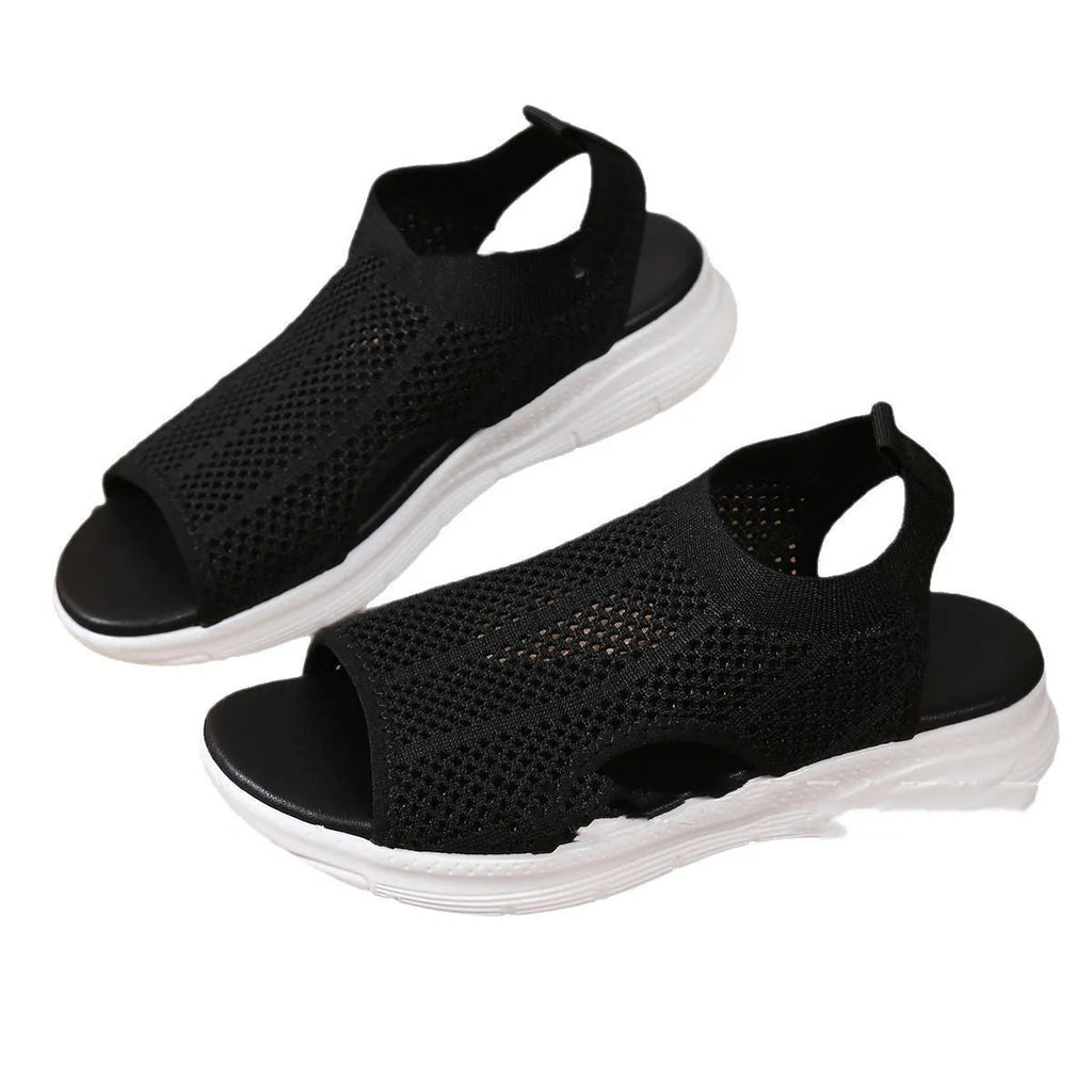 Women's black platform sports sandals with a flat toe bracket and mesh lining on a rubber sole.