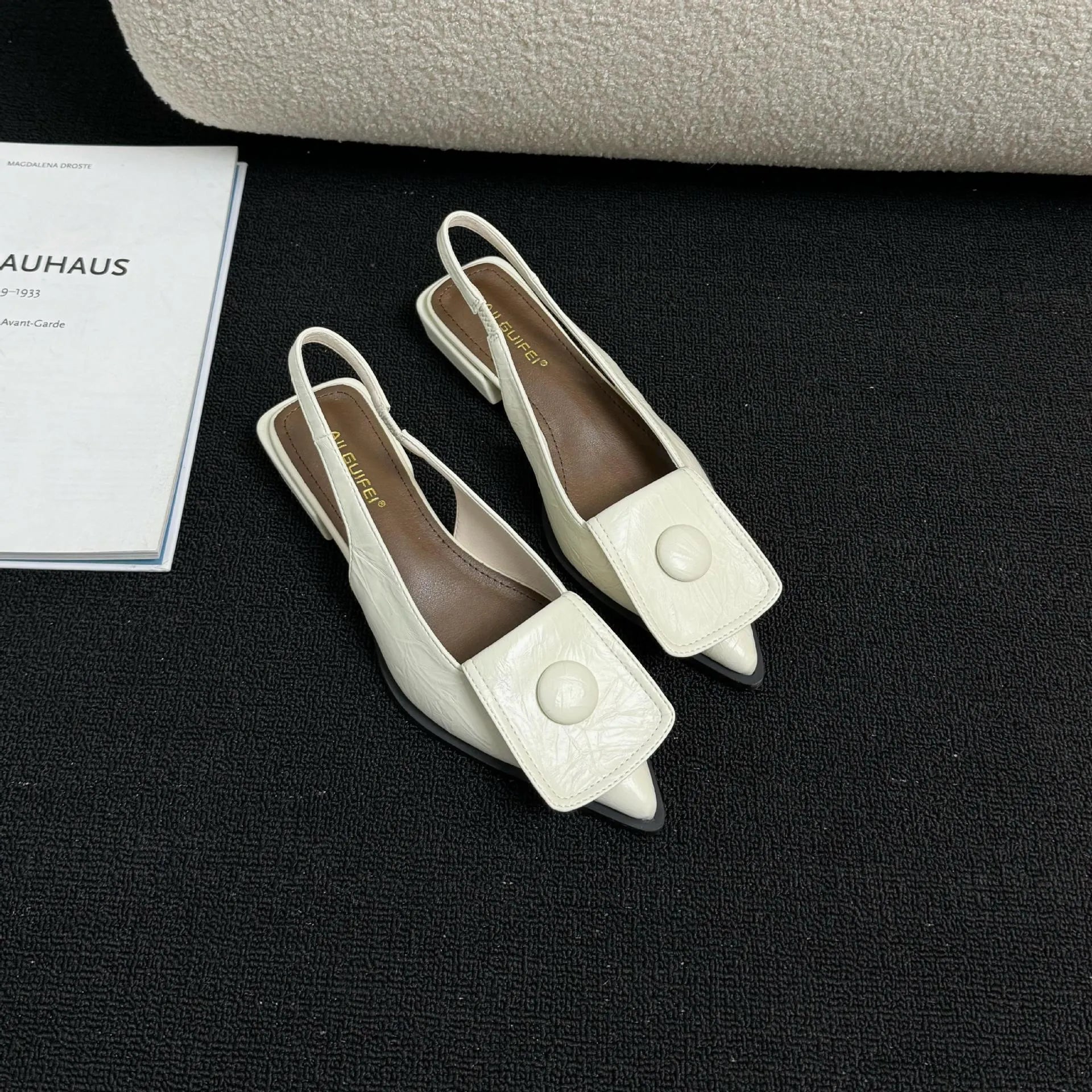 Women's low heel sandals with pointed closed toe and back strap in apricot colour