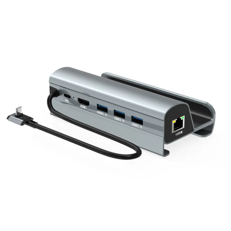 GPD WIN4 handheld game console dock in black and silver grey, showing interface ports on the base expander.