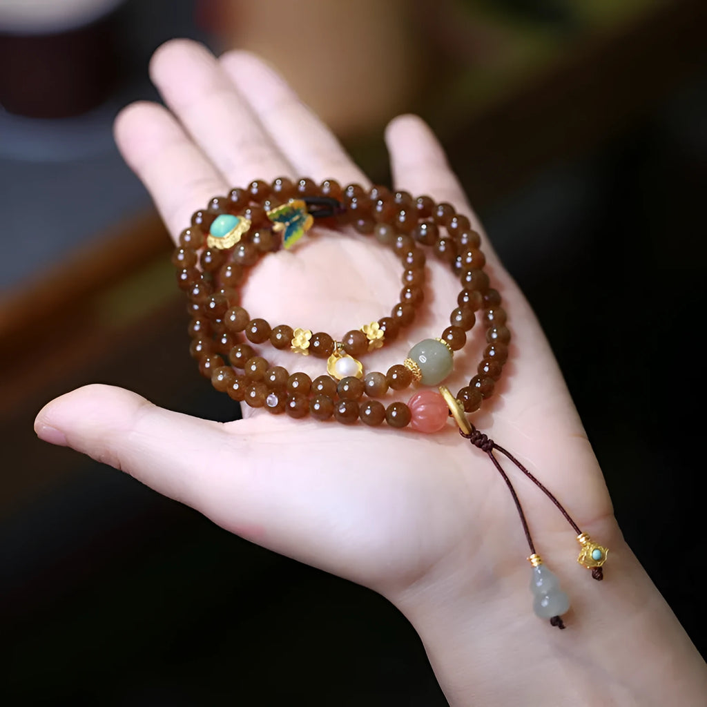 Brown Hetian jade three-ring bracelet with geometric design, butterfly motifs and silver accessories