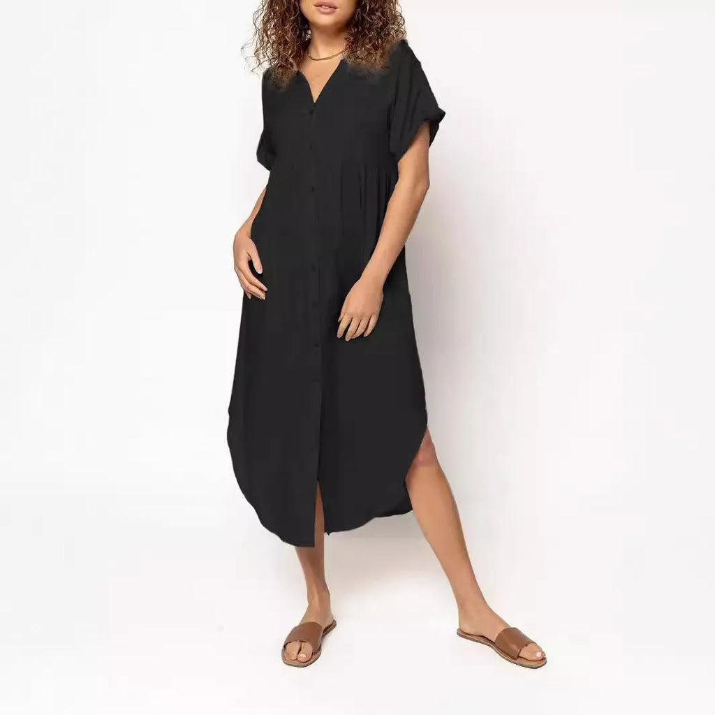 Loose-fit mid-length dress with button front in polyester fabric, available in multiple colours and sizes.
