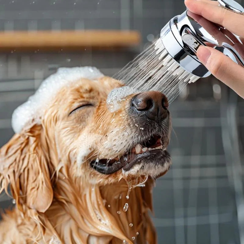 Silver dog shower attachment with silicone comb teeth and ergonomic grip for bath time