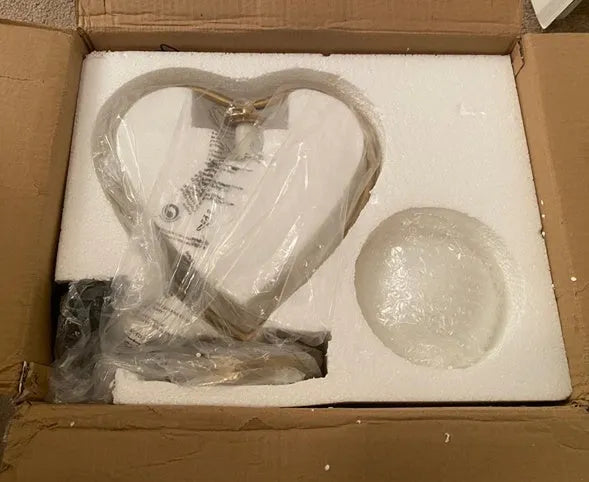 Heart-shaped table lamp with touch-sensitive base and 5W LED bulb on a table