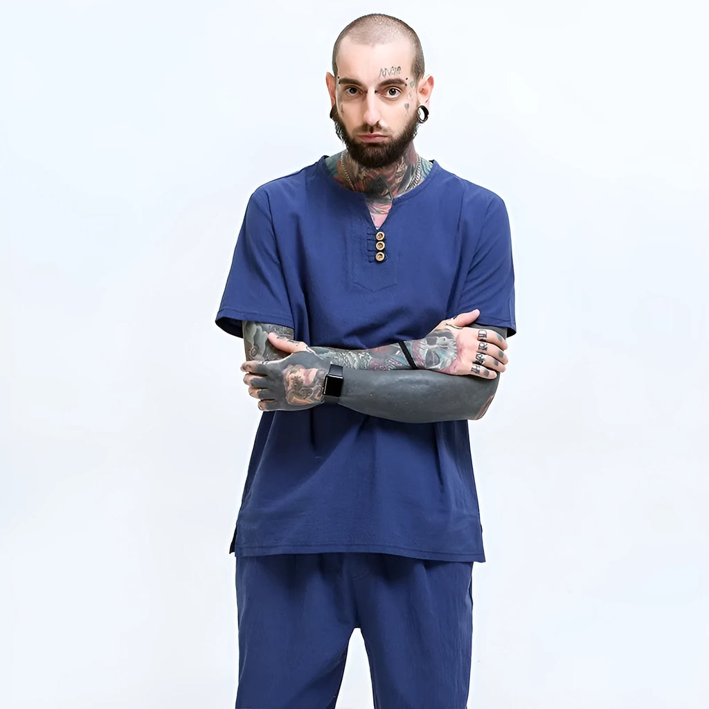 Man wearing a loose apricot coloured cotton linen blend t-shirt, showing the relaxed short sleeve pullover style.