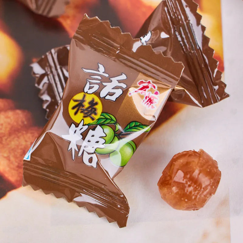 Assortment pack of plum sugar, guava, and tangerine peel flavoured hard candies in separate bags.