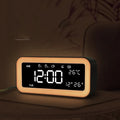 Rectangular LED atmosphere alarm clock in blue or pink with digital display and music function