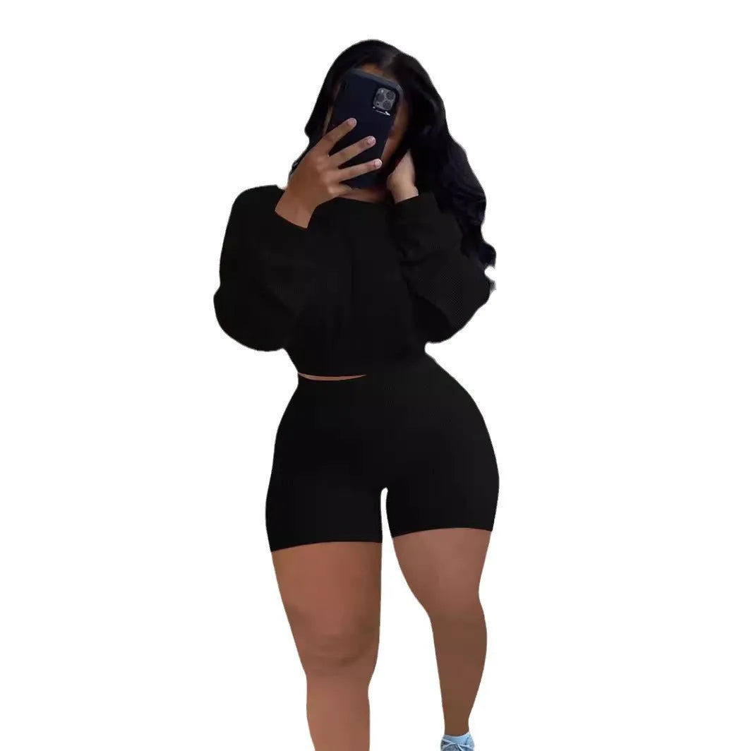 Women's solid colour off-the-shoulder long sleeve top and shorts two-piece set.