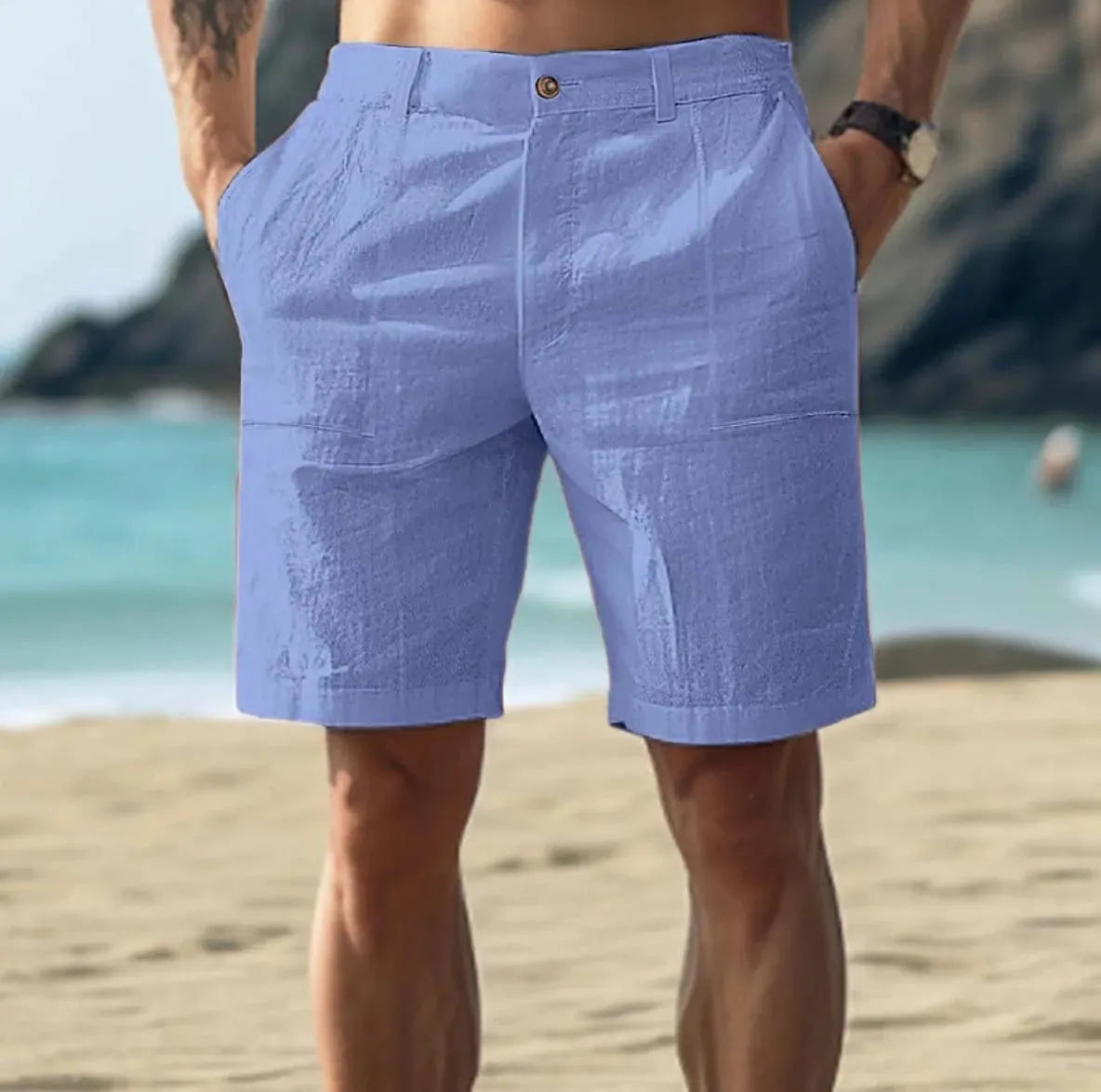 Men's solid colour cotton casual trousers with a button fly, shown in dark blue.