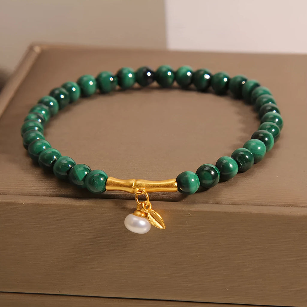 White crystal lucky bamboo bracelet for women with a high-rise design on a wrist.