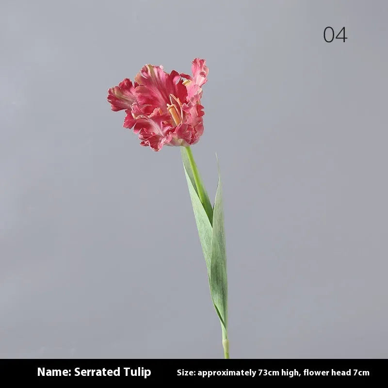 Artificial toothed tulip fake flower arrangement in bright red colour on wooden table