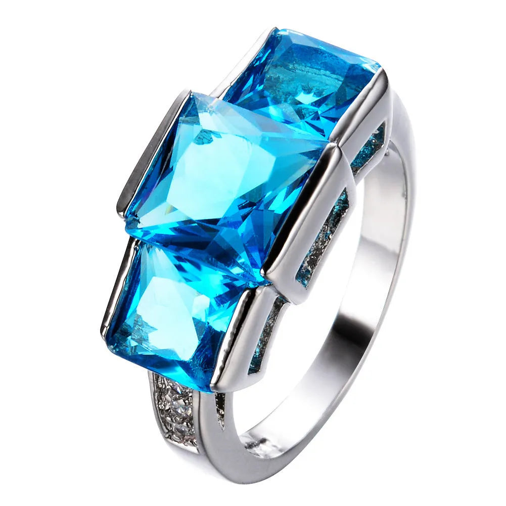 Copper women's ring with geometric design and electroplated colour finish, showing rainbow metal elements
