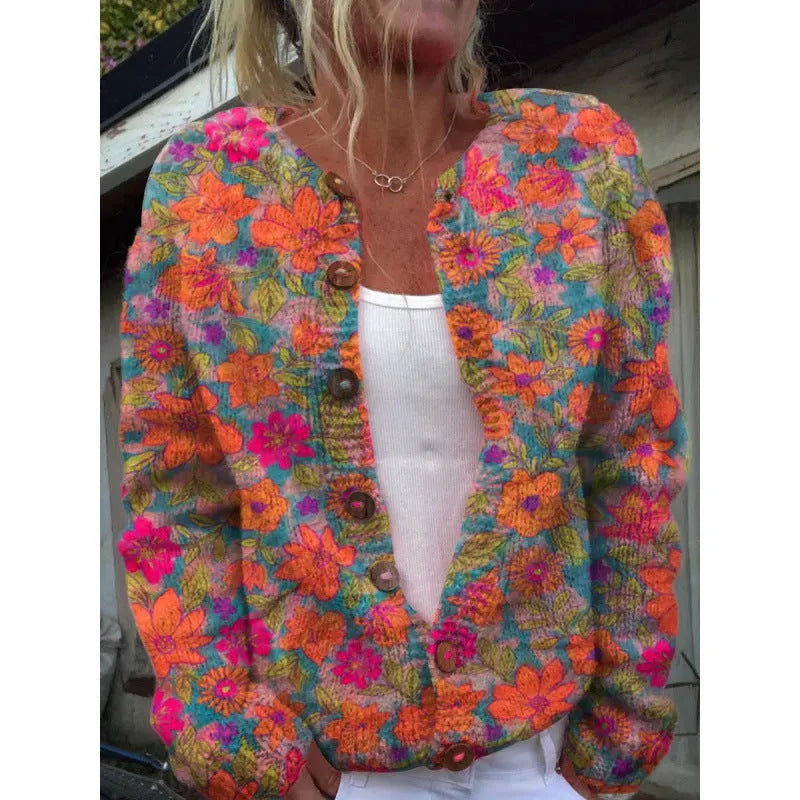 Yellow cardigan knitted coat with a raised 3D digital print pattern, shown on a hanger.