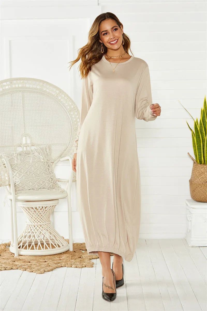 Black lace-up crew neck lantern dress with adjustable front lacing and loose fit, made from knitted polyester.