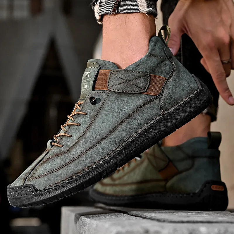 Men's mid-top Martin boots with elastic band closure in khaki colour, showing round toe and mid-calf design