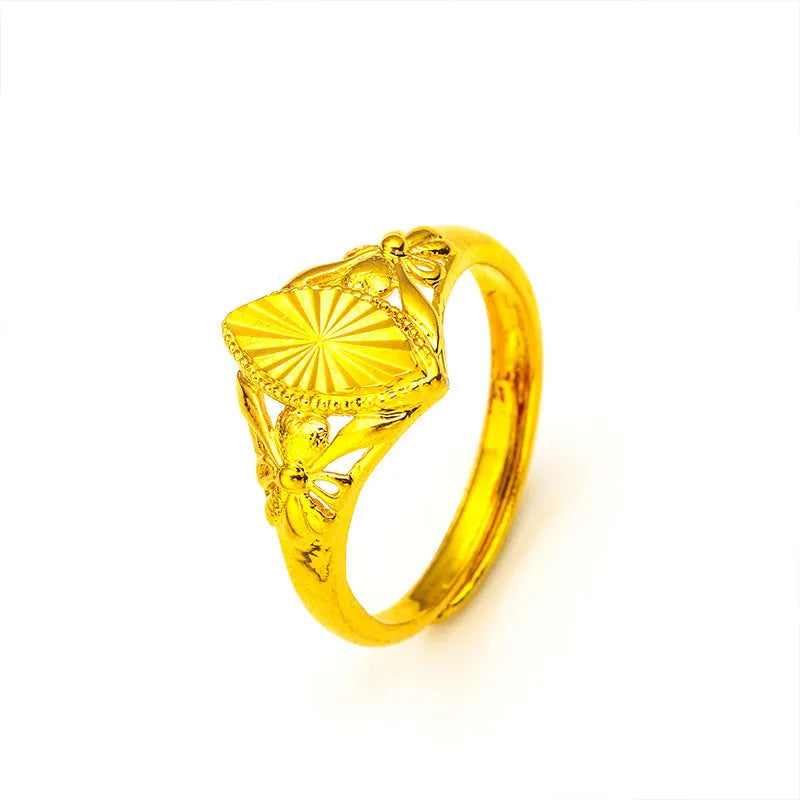 Gold geometric flower ring with textured surface and open adjustable band design